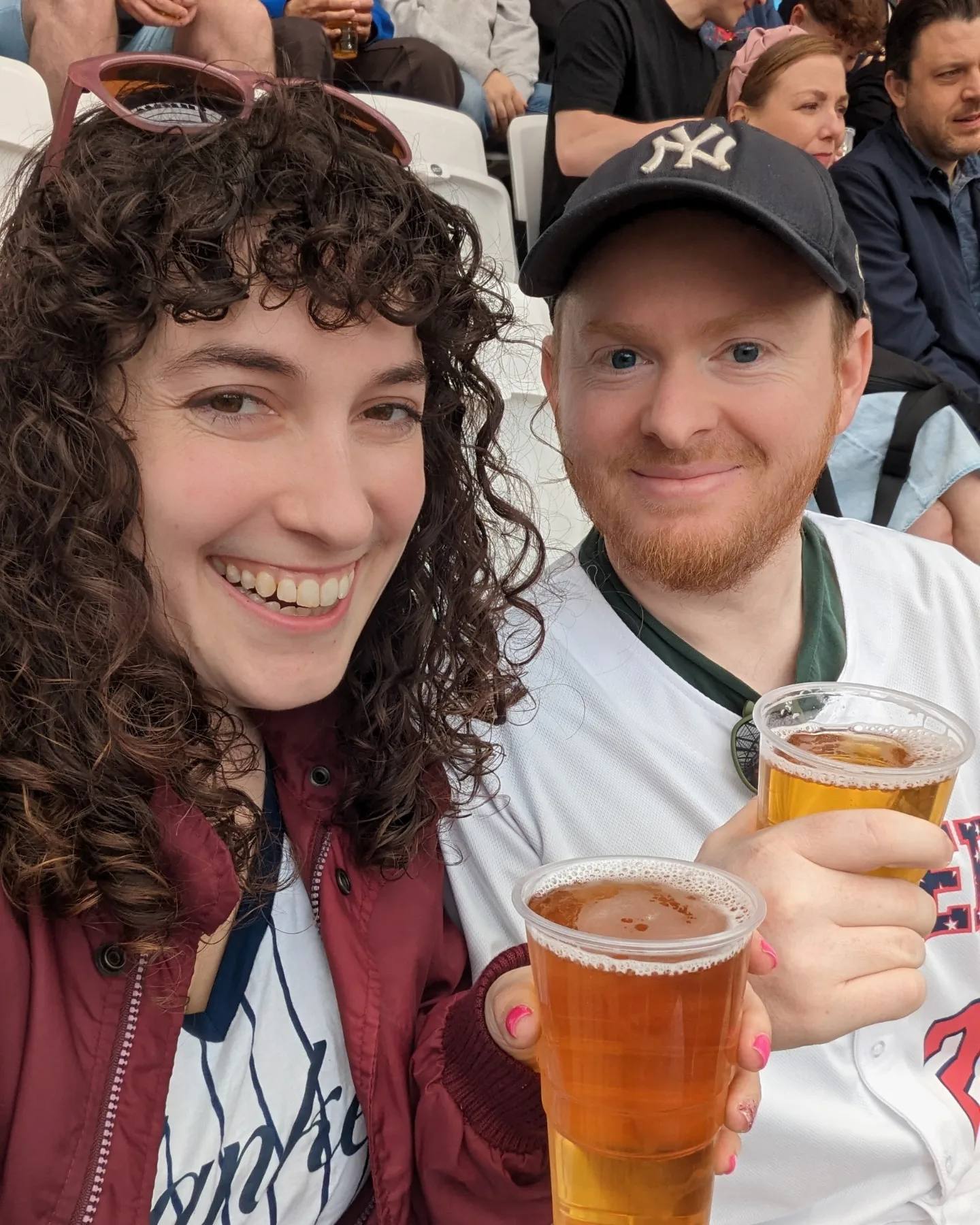 Becca and Q posing with beers